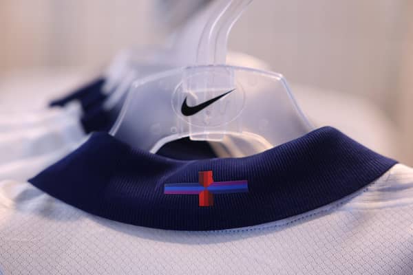 Racks of England's new Nike designed football shirt, with the controversial St George's cross, are displayed for sale in a central London store last week (Photo by DANIEL LEAL/AFP via Getty Images)