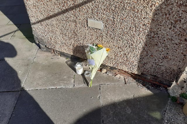 A floral tribute in Marshall Wallis Road following the death of a 25-year-old man.