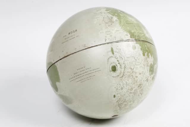 An early 1960s American Replogle Globes Inc model of the Moon.