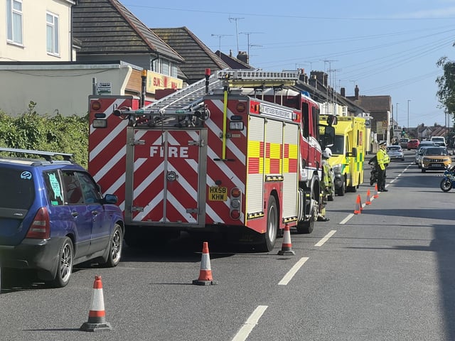 Two people taken to hospital after car collides with building in West Sussex