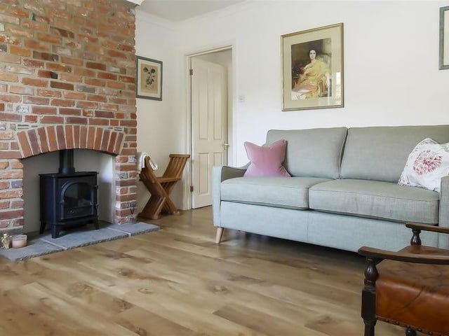 There is a cosy lounge at the front, with fireplace and sash window