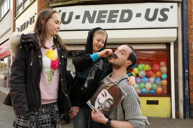 Matthias Hepworth and his children, Ben, 8, and Sophia, 11, outside U-Need-Us on its last day of trading. Picture: Chris Moorhouse (300319-21)