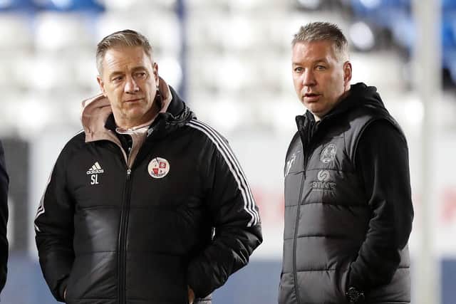 Crawkey Town boss Scott Lindsey and Peterborough United manager Darren Ferguson on Wednesday night. Picture: Joe Dent