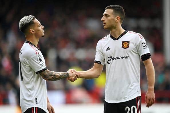 Diogo Dalot of Manchester United celebrates with teammate Antony at Nottingham Forest