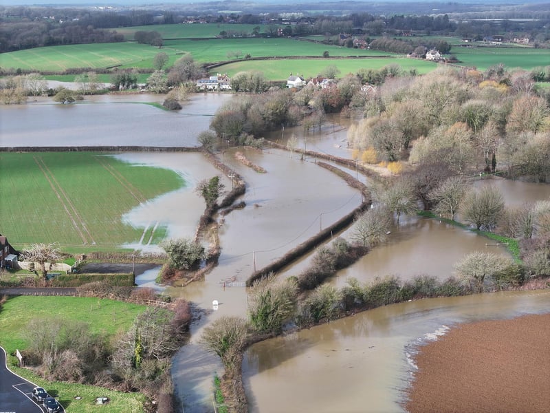 A road off the A26 remains closed following heavy rainfall last week which has submerged a village near Lewes.
