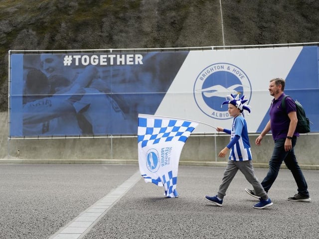 Fans arrive at the stadium prior to the Premier League match between Brighton and Hove Albion and West Bromwich Albion at Amex Stadium on September 9, 2017.