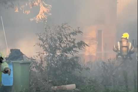 Footage shared on Facebook, by South Coast Live, showed firefighters and emergency vehicles at the scene as crews dealt with the incident. Photo: South Coast Live / Facebook