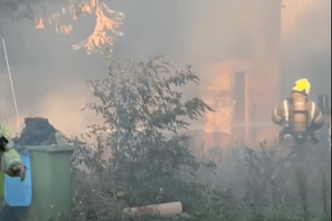 Footage shared on Facebook, by South Coast Live, showed firefighters and emergency vehicles at the scene as crews dealt with the incident. Photo: South Coast Live / Facebook