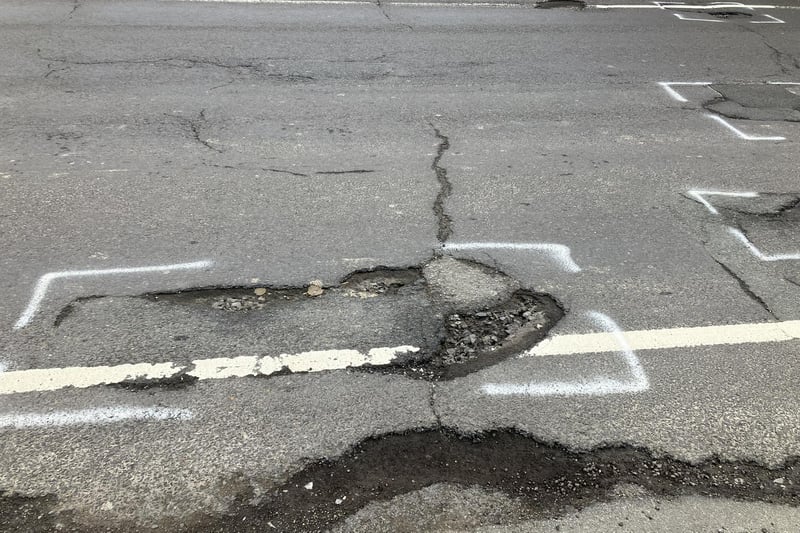 Drivers and cyclists have to take extra care when facing oncoming traffic in St Leonard's Road, Horsham, because of the number and depth of potholes