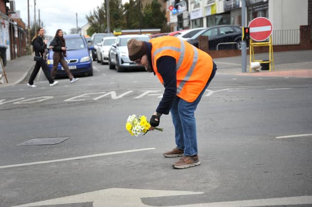 Flowers laid at the site of the former mini-roundabout. Pic S RobardsSR2303061