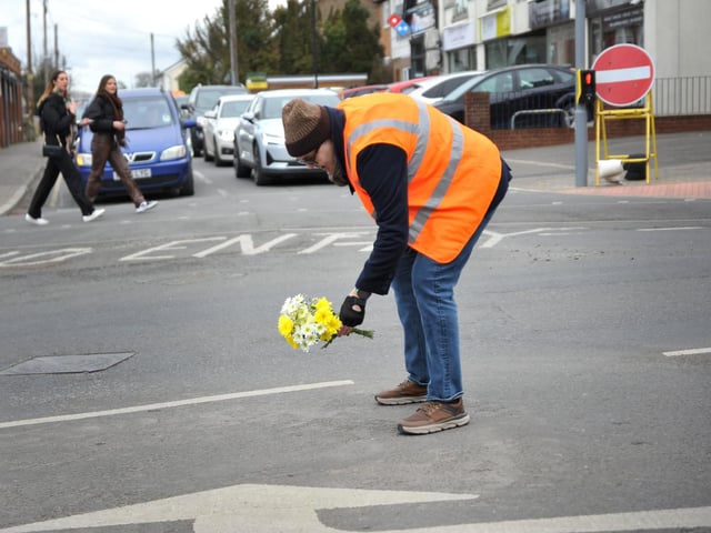 Flowers laid at the site of the former mini-roundabout. Pic S RobardsSR2303061