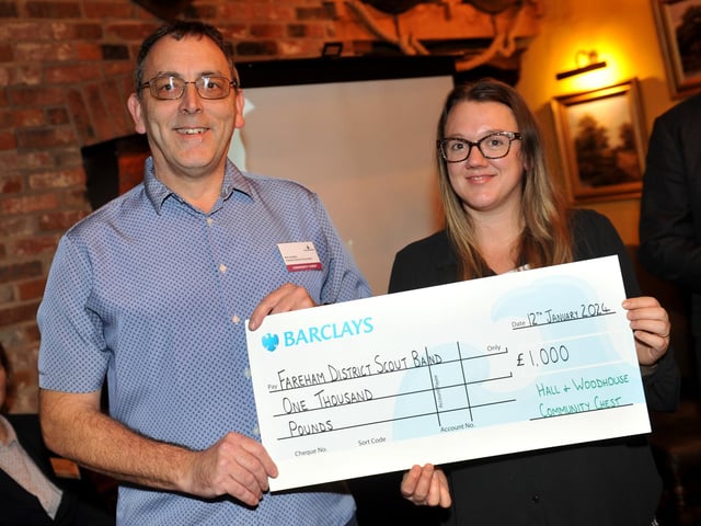 Judge Bex Bastable presents a cheque for £1,000 to Fareham District Scout Band