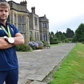 Tom Mitchell at Worth School with his silver medal from the Rio Olympics