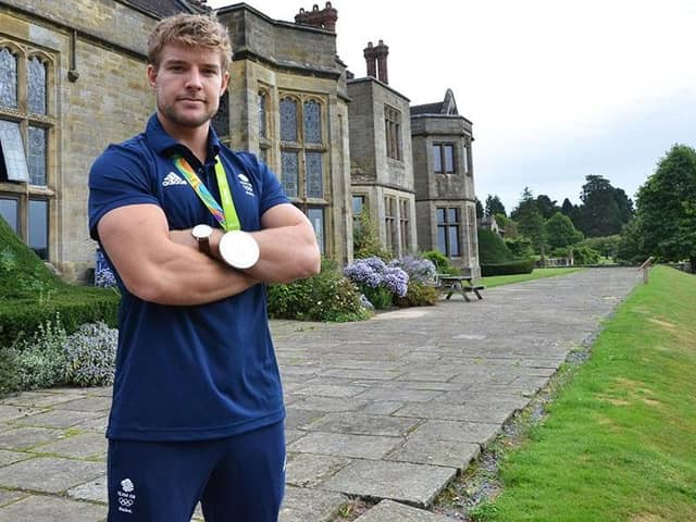 Tom Mitchell at Worth School with his silver medal from the Rio Olympics