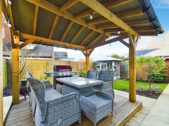 A generous covered patio provides the ideal space for summer barbecues