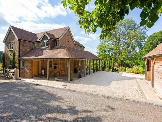 Birchen Lodge has a large garage and store with a home office to one side