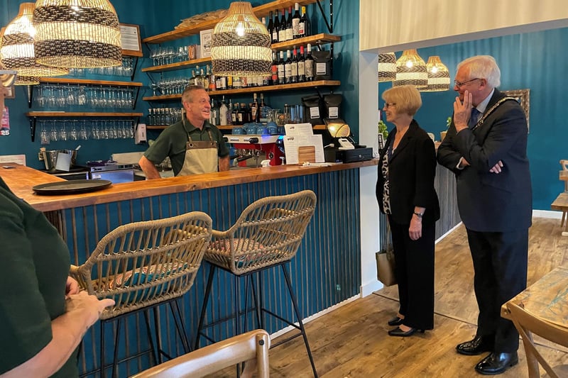 The Safari Pizza co, pizzeria and wine bar is at 21 The Broadway, Haywards Heath. It has a rating of 4.5 stars from 69 reviews. Pictured: The team at Safari with Haywards Heath town mayor Howard Mundin and his consort Margaret Baker.
