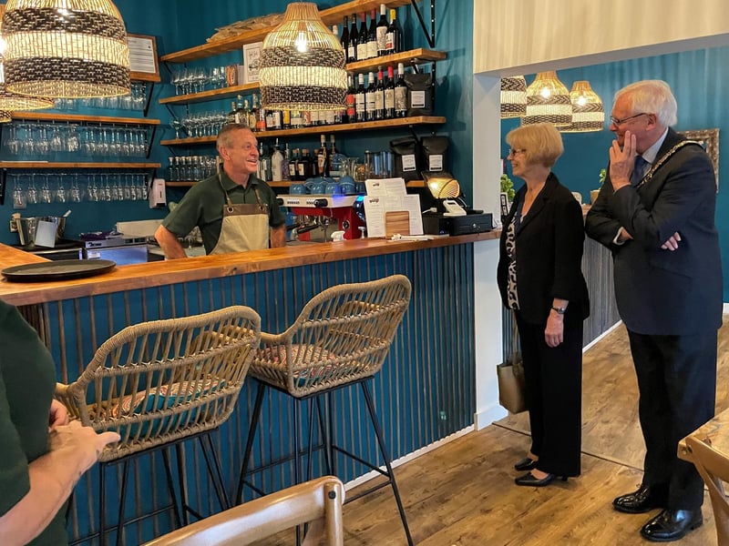 The Safari Pizza co, pizzeria and wine bar is at 21 The Broadway, Haywards Heath. It has a rating of 4.5 stars from 69 reviews. Pictured: The team at Safari with Haywards Heath town mayor Howard Mundin and his consort Margaret Baker.