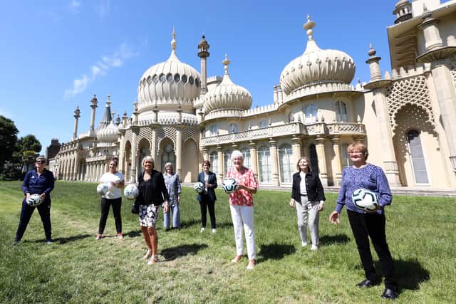 Goal Power Women’s Football 1894-2022 Exhibition launch outside the Royal Pavilion in Brighton.
L-R Chris Lockwood, Maggie Murphy, Rose Reilly, Leah Caleb, Kelly Simmons, June Jaycocks, Gill Sayell and Eileen Bourne
Photo/James Boardman/Alamy Live News