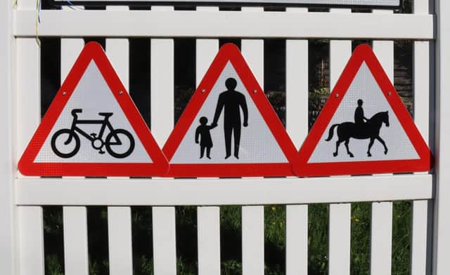 Close-up picture of signs: Speed limit policy changes in West Sussex will help vulnerable road users, such as cyclists, pedestrians, and equestrians