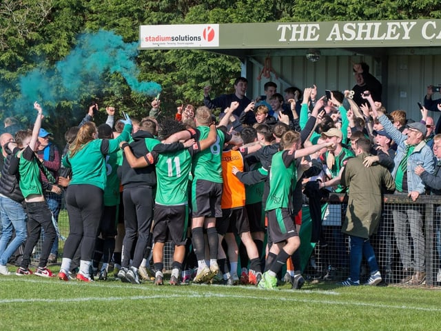 Burgess Hill Town players, fans and staff celebrate surviving in the Isthmian south east division at the end of their 0-0 draw with Beckenham
