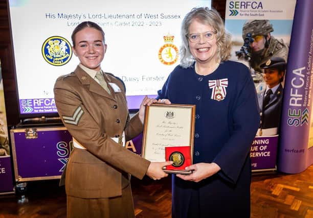 Cadet Cpl Daisy Forster Receives her award From the Lord Lieutenant of Sussex during an Award Ceremony at Christs Hospital.