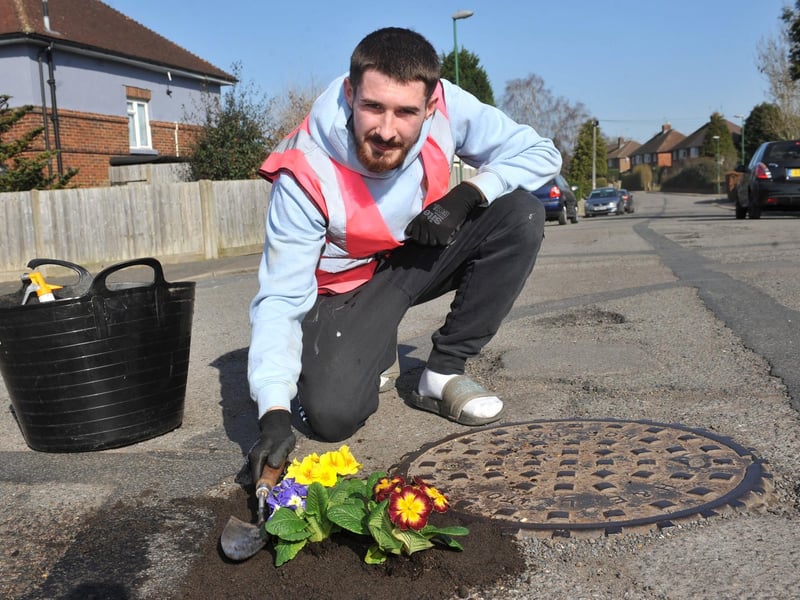 Harry Smith-Haggett planting up potholes Orchard Road, Horsham.