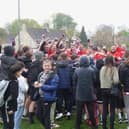 Steyning's players and fans celebrate the title and promotion | Picture: Steyning Town FC