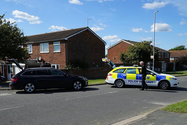 Police at the scene in Milfoil Drive, Eastbourne