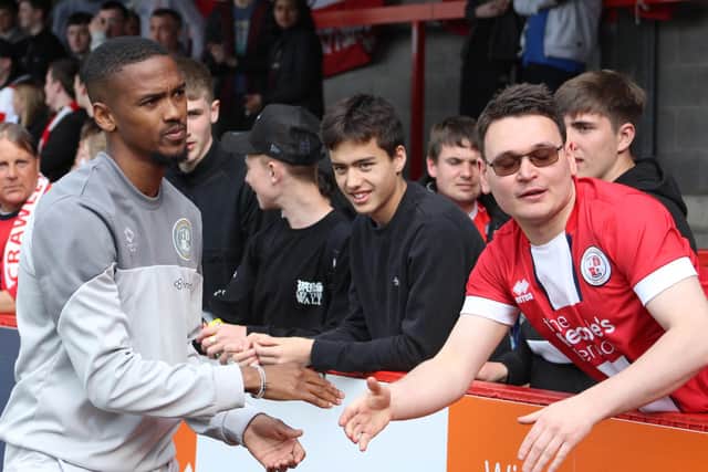 Lewis Young with Reds fans after the game. Picture by Cory Pickford