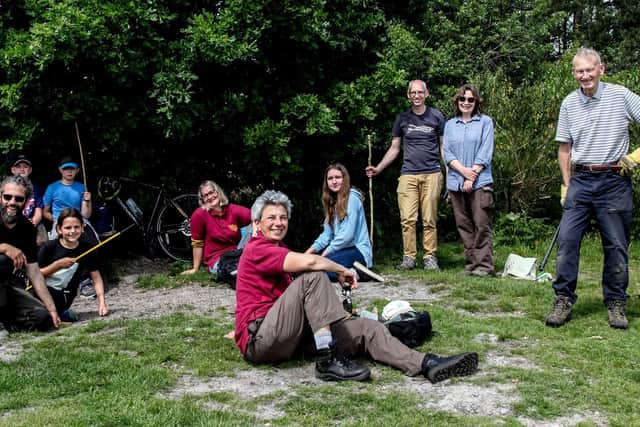 Members of Sandgate Conservation Society take a break during work on Sullington Warren. Photo: Brian Burns