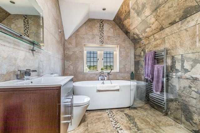 The property's bathrooms are all tastefully in keeping with the property