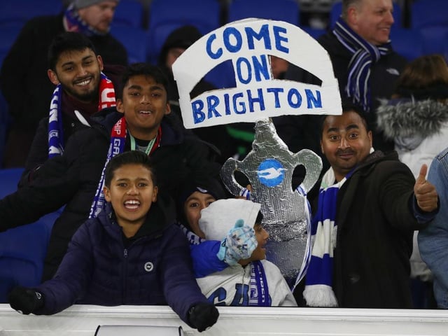 Brghton fans hold a tin foil FA Cup prior to The Emirates FA Cup Third Round match between Brighton & Hove Albion and Crystal Palace at Amex Stadium on January 8, 2018.