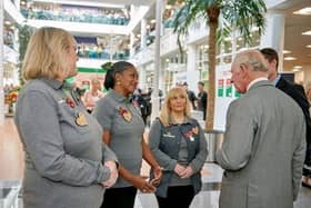 King Charles III at Morrisons' HQ chatting with Alison Whitburn from the Littlehampton store, left, and other community champions