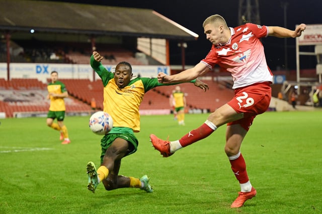 Owen Dodgson of Barnsley in action during the Emirates FA Cup First Round match between Barnsley and Horsham at Oakwell Stadium.