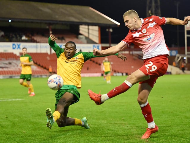 Owen Dodgson of Barnsley in action during the Emirates FA Cup First Round match between Barnsley and Horsham at Oakwell Stadium.