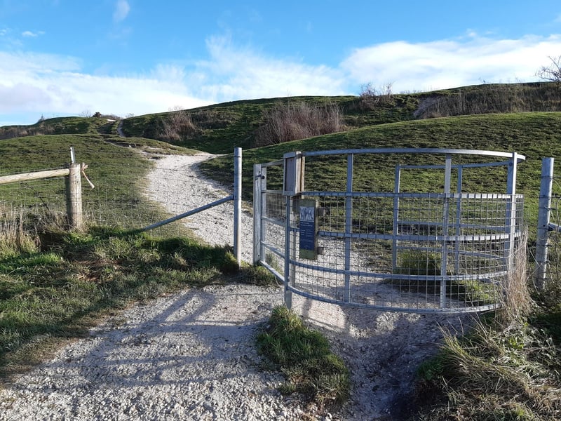 Pass through this gate on to the top of the Iron Age hill fort.