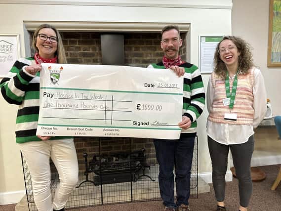 Two Heathfield District Bonfire Society members attended Hospice in the Weald to handover their cheque.