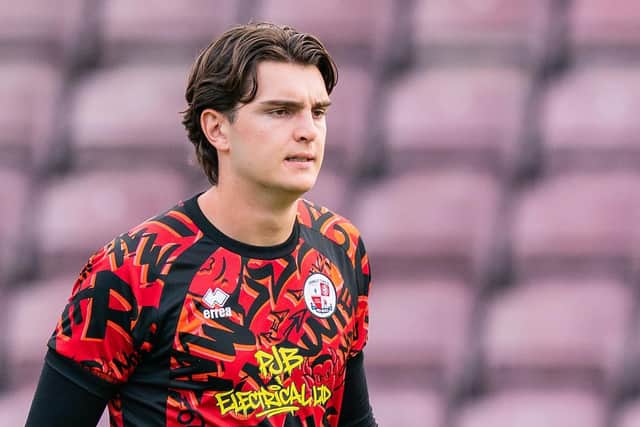 Crawley Town keeper Jackson Izquierdo warms up before the Northampton game | Picture: Kyle Hemsley