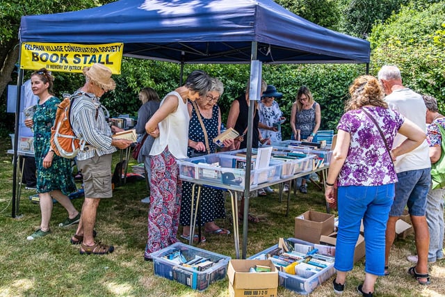 Residents browse boxes at the fete's used book stall. Photo: Tony Lord