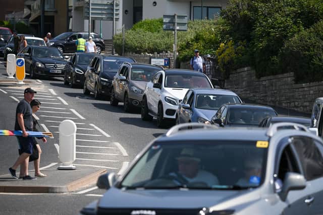With hot weather, holiday getaways and planned rail strikes in the coming days, National Highways has issued advice to Sussex motorists and their passengers. Picture by Finnbarr Webster/Getty Images
