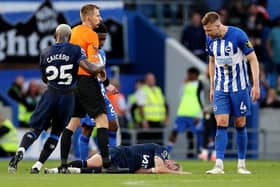 BRIGHTON, ENGLAND - MAY 15: Mykhaylo Mudryk of Chelsea goes down with an injury as Adam Webster of Brighton & Hove Albion reacts during the Premier League match between Brighton & Hove Albion and Chelsea FC at American Express Community Stadium on May 15, 2024 in Brighton, England. (Photo by Ryan Pierse/Getty Images)