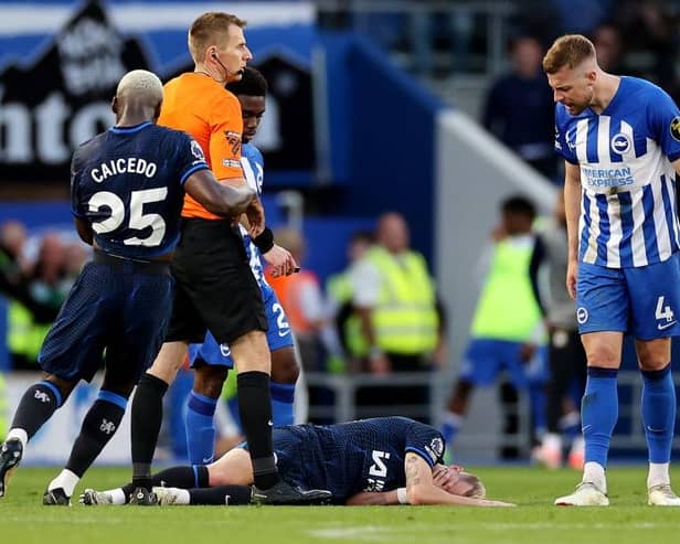 BRIGHTON, ENGLAND - MAY 15: Mykhaylo Mudryk of Chelsea goes down with an injury as Adam Webster of Brighton & Hove Albion reacts during the Premier League match between Brighton & Hove Albion and Chelsea FC at American Express Community Stadium on May 15, 2024 in Brighton, England. (Photo by Ryan Pierse/Getty Images)