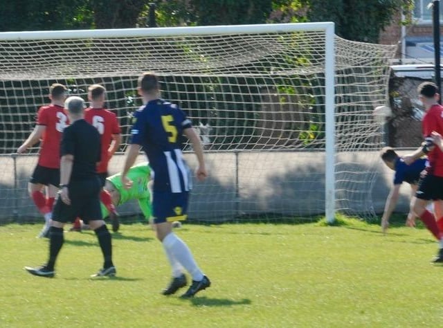 Action from Wick's home defeat to Godalming in the SCFL Division 1 at Crabtree Park