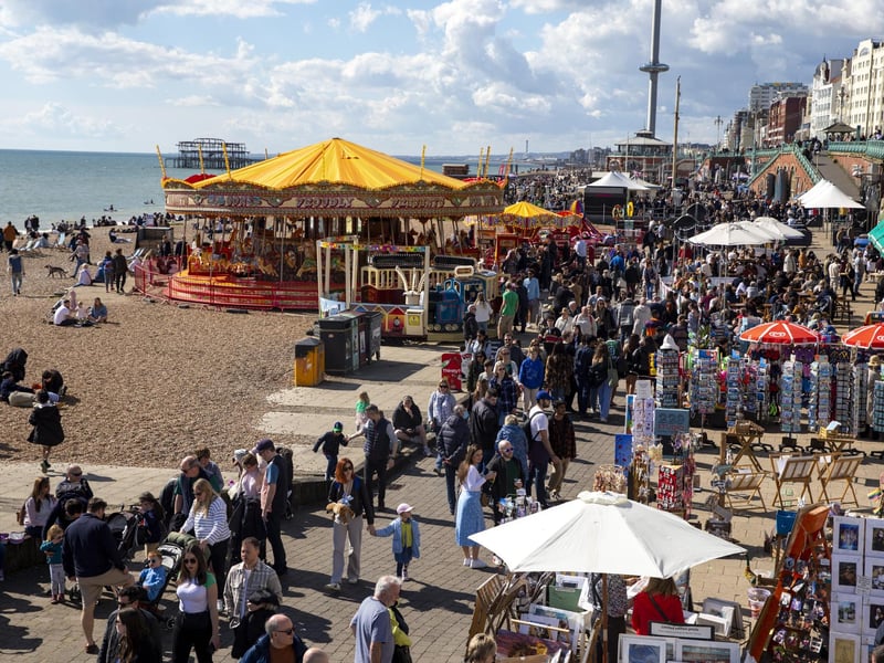 People enjoy the spring sunshine this Good Friday on Brighton beach in East Sussex.