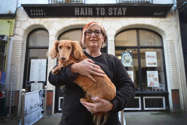 Cheryl and her 'dream dog' Baer outside the hair salon in George Street, Hastings.