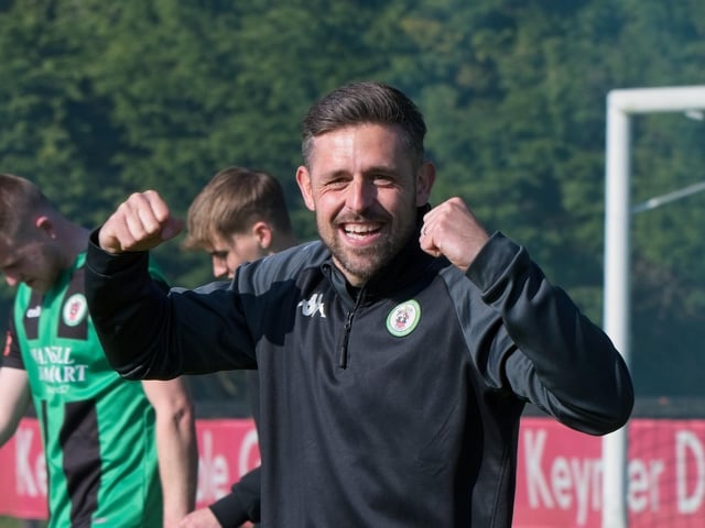 Burgess Hill Town players, fans and staff celebrate surviving in the Isthmian south east division at the end of their 0-0 draw with Beckenham
