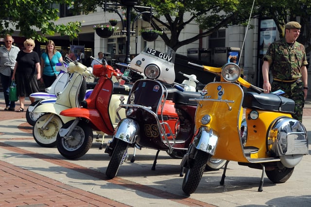 Scooters in all shades graced the pavement in South Street Square in June 2011