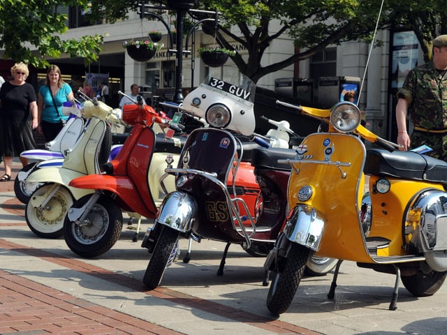 Scooters in all shades graced the pavement in South Street Square in June 2011