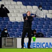 Graham Potter, manager of Brighton and Hove Albion gives their team instructions during the Premier League match between Brighton & Hove Albion and Aston Villa at American Express Community Stadium on February 13, 202.